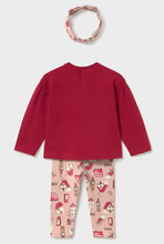Load image into Gallery viewer, Back view of a toddler girl's three-piece clothing set featuring a solid red long-sleeve top, pink pants with a red and white house pattern, and a matching pink patterned headband, by Mayoral available on kidstuff.ie