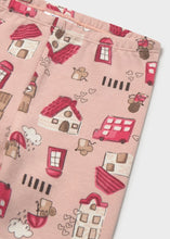 Load image into Gallery viewer, A close-up of a pink fabric legging, a featuring a playful print of little houses, and clouds.