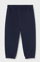 Load image into Gallery viewer, A pair of dark navy blue sweatpants with an elastic waistband and elastic cuffs.