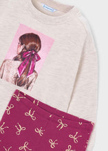 Load image into Gallery viewer, Beige sweatshirt with a pink graphic of a girl with a bow and wine pants with beige bow pattern