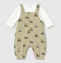 Load image into Gallery viewer, A baby's long-sleeve footless jumpsuit featuring a sage green body with a colorful tractor pattern, worn over a creamlong-sleeve shirt.
