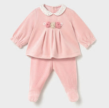 Load image into Gallery viewer, A baby girl's two-piece footed set in light pink velour, featuring a long-sleeve top with a cream floral Peter Pan collar and a pink and beige flower applique at the chest, paired with matching pink footed pants.