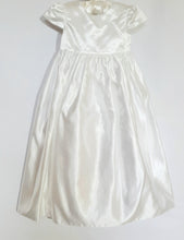 Load image into Gallery viewer, A beautiful three piece Christening outfit comprising a simple white satin gown with cap sleeves, an embroidered organza lace effect "coat" to wear over it, and a matching bonnet. The "coat"  has puff sleeves decorated with bows. It is fastened with pearl buttons and loops and is edged in guipure style lace trimming. The bonnet is fastened with velcro and is edged with a pretty organza frill.