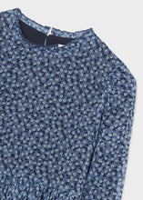 Load image into Gallery viewer, Girl's dress in blue printed and pleated chiffon. Mayoral girl's dress 4961 in navy blue. Border-print girls dress with long sleeves andpleated skirt. Detail view.