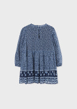 Load image into Gallery viewer, Girl's dress in blue printed and pleated chiffon. Mayoral girl's dress 4961 in navy blue. Border-print girls dress with long sleeves andpleated skirt. back view.