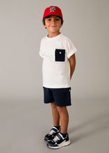 Load image into Gallery viewer, child wearing Boy's white top with navy pocket,  and boy's navy shorts with pockets. Mayoral  3601 boys 3 piece outfit available to buy on kidstuff.ie
