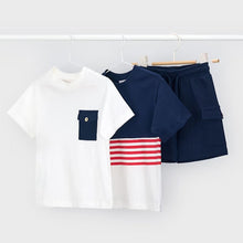 Load image into Gallery viewer, Boy's white top with navy pocket, boy's navy and white top with red stripes and boy's navy shorts with pockets. Mayoral  3601 boys 3 piece outfit available to buy on kidstuff.ie
