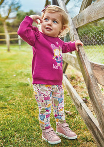 toddler girl's outfit with a magenta sweatshirt and printed leggings. Mayoral 2767  for a girl.  Pink leggings and top  set for a baby girl available on kidstuff.ie