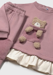 girls pink tracksuit top with fancy 3d appliqué teddy-bear on the front and cream frill detail to the hem. Matching pink jog bottoms with pockets. Mayoral 2843 girl's outfit available on kidstuff.ie