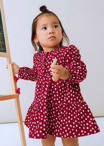 Child earing a Red long sleeved dress with cream polka dots.  Mayoral 2915 girl's dress available on kidstuff.ie