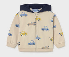 Load image into Gallery viewer, A children's zip-up hooded jacket in cream with an all-over pattern of small blue and yellow cars, featuring a dark navy hood and front zipper
