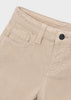 Close-up of a pair of light beige corduroy pants showing the waistband, belt loops, front pocket, and a metal button closure 