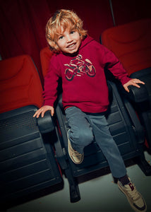  Child wearing a boys Red hoody sweatshirt with motorbike print on the front. Mayoral 4407 in red available on kidstuff.ie
