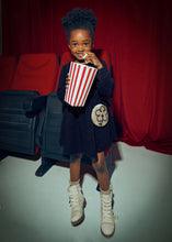Load image into Gallery viewer, Girl wearing  Navy polka dot long sleeve jersey dress with matching bag. Mayoral 4926 available on kidstuff.ie
