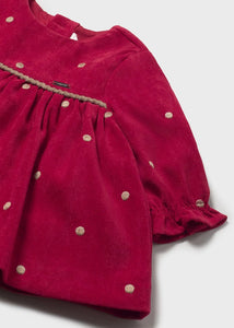 Red long sleeved velvet dress for a baby girl with gold/beige polka dots .Mayoral 2820 available on kidstuff.ie