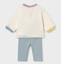 Load image into Gallery viewer, A baby two-piece outfit set featuring a cream long-sleeve top with pastel purple collar, aqua cuffs, and yellow sleeve trim, paired with light aqua pants..
