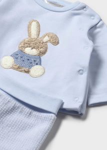 Baby boy's sky blue two piece outfit with long sleeved top and bunny rabbit appliqué. Matching sky blue bottoms with feet in . Mayoral 2566 available on kidstuff.ie