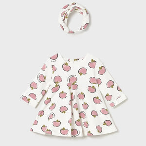 Baby dress with pink apple pattern on cream and matching headband . Mayoral 2827 baby dress se available on kidstuff.ie
