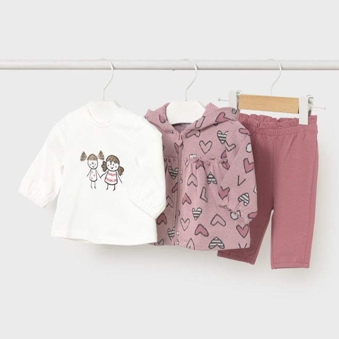 Baby girl's clothing set with a cream shirt, pink heart-patterned jacket with hood, and pink pants. Mayoral 2633 available on kidstuff.ie
