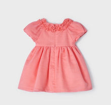 Load image into Gallery viewer, A beautiful dress for a baby or toddler girl in coral pink . High-waisted style . Short puff sleeves and neckline decorated with ruffles. Waist embellished with fabric bow two roses Net underneath. Centre back concealed zipper.  Mayoral 1908
