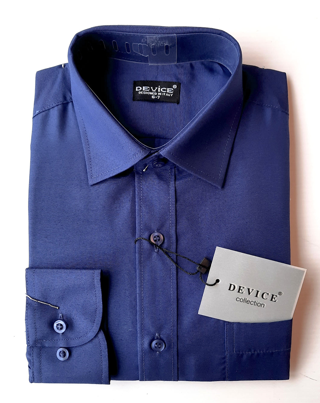 A classic, long sleeved shirt in a dark bluey- purple shade. Smooth fabric, classic non-fitted style. Two button cuff which allows for adjustment to suit. Perfect for special dressing including First Communion. Made by Device.
Size labelling is not age.
