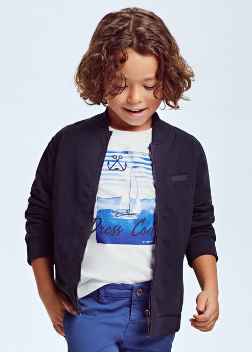 Navy Blue boys cardigan jacket.This boy's fleece jacket in navy blue is just so handy to finish off any outfit ! Neat trendy styling with ribbed cuffs and collar-band. Centre front zipper and zipped pockets. Long sleeves. Comfortable yet smart. Made by Mayoral.