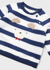 Baby boy's striped top with long sleeves and appliquéed teddy bear motif, in soft, cotton-rich jersey. Handy shoulder fastening with press studs. Co-ordinating jog bottoms in red have pockets and a soft stretchy waist for comfort. An Ecofriends outfit by Mayoral containing sustainable cotton, available on kidstuff.ie Top detail